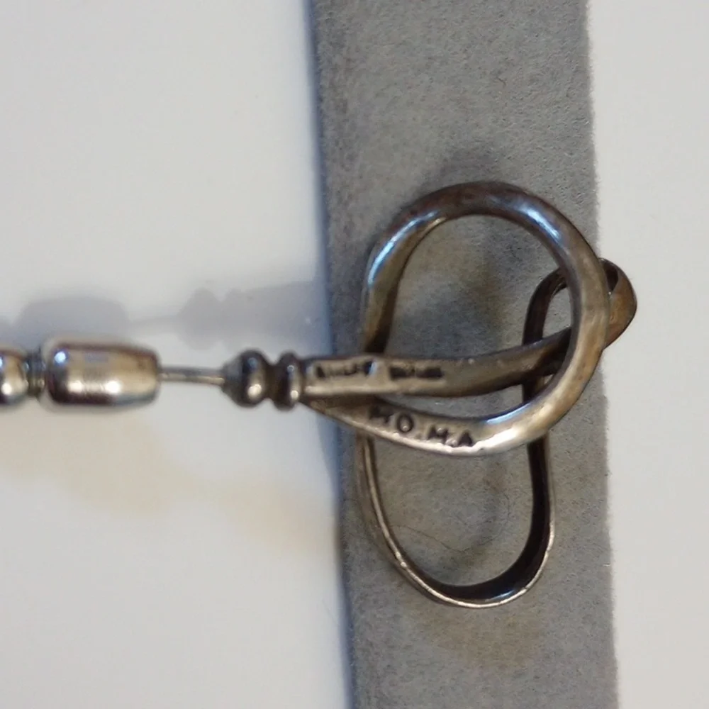 Vintage calla lily flower pin marked MoMA and sterling